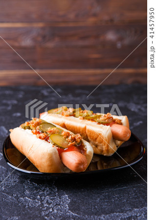Photo of hotdogs on black plate Photo of hotdogs on black plate 41457950