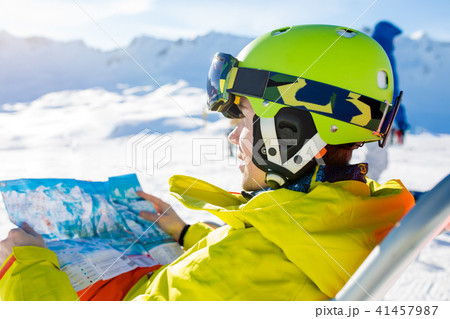 Image of sporty man in helmet sitting at chair Image of sporty man in helmet sitting at chair 41457987