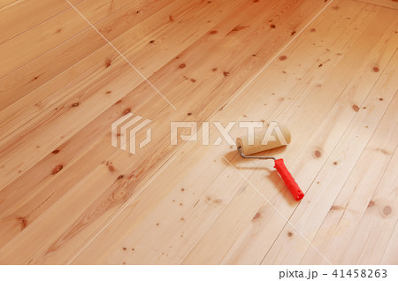 Paint roller brush on wood background 41458263