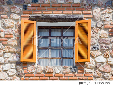 Opening windows from the house made from rocks 41459199
