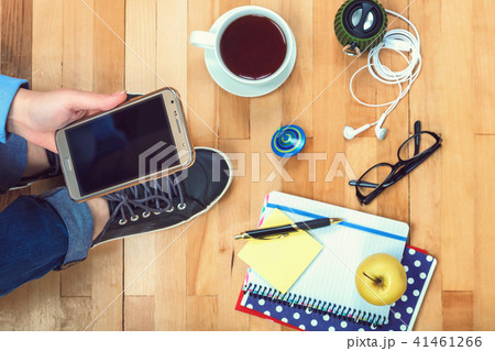 Female hand with a mobile phone and stationery Female hand with a mobile phone and stationery 41461266