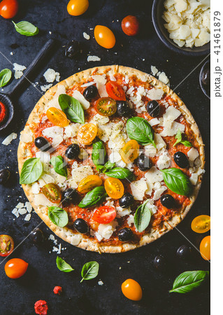 Traditional italian pizza on dark table Traditional italian pizza on dark table 41461879