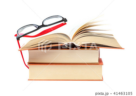 Open book and glasses on a stack of books 41463105