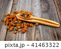 Dried calendula flowers on wooden Medicinal plants 41463322