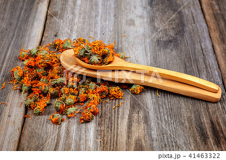 Dried calendula flowers on wooden Medicinal plants 41463322