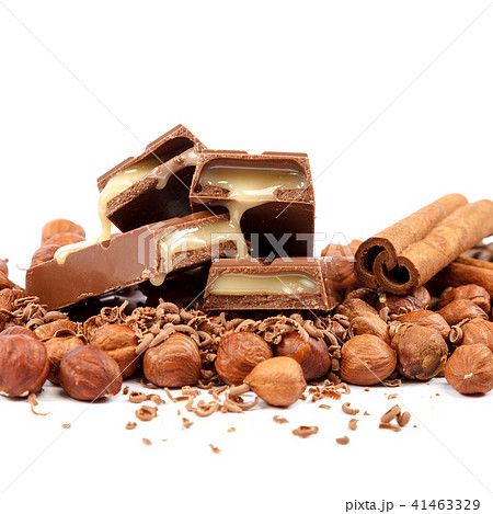 Chocolate tiles and nuts on white background Chocolate tiles and nuts on white background 41463329