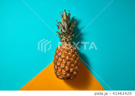 Fresh pineapple isolated on blue orange background top view 41463420