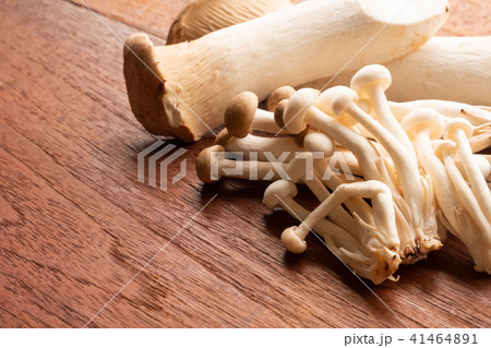 Mixed organic mushrooms on wooden table Mixed organic mushrooms on wooden table 41464891