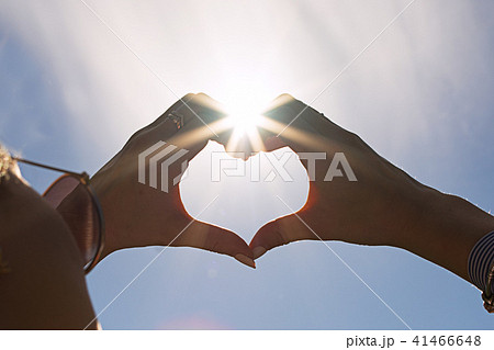 Couple in love making a heart with their hands 41466648