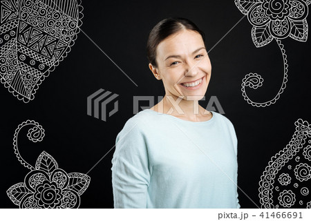 Cheerful baby sitter smiling and looking friendly 41466691
