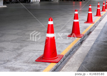 Orange traffic cone or funnel standing a row Orange traffic cone or funnel standing a row 41469580