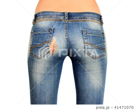 The back side of the female ass in torn blue jeans The back side of the female ass in torn blue jeans 41471070