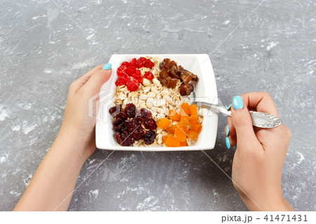 the girl cooked her muesli for breakfast 41471431