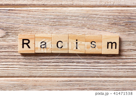 Racism word written on wood block. Racism word written on wood block. 41471538