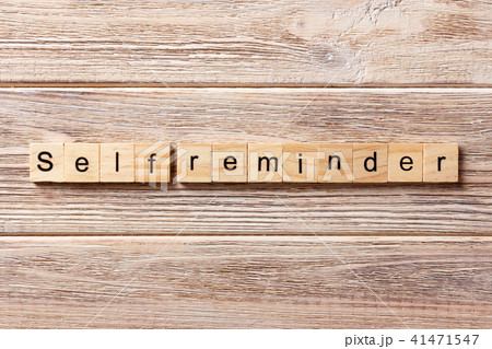 self reminder word written on wood block. self reminder word written on wood block. 41471547