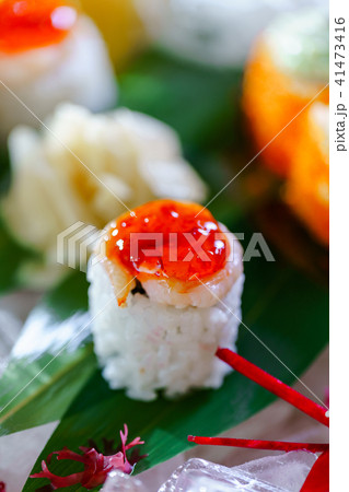 A lot of sushi rolls with different fillings. Shot of cooked classic Japanese food served on ice 41473416