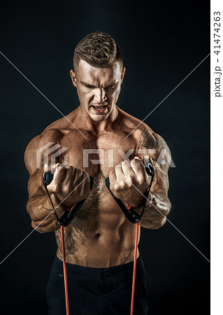 Muscular man working out Muscular man working out 41474263