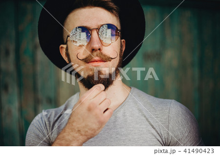 Hipster in sunglasses with fashionable mustaches 41490423