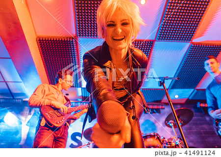 Singer of band on stage during gig or concert Singer of band on stage during gig or concert 41491124