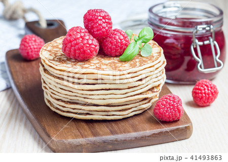 Stack of pancakes or fritters with raspberry Stack of pancakes or fritters with raspberry 41493863