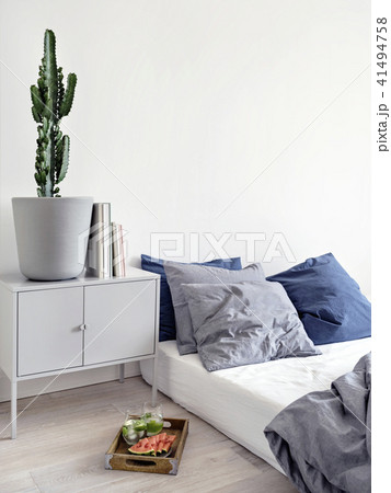 Watermelon with beverage at minimalistic bed. 41494758