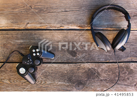 Video game controller and headphones   41495853