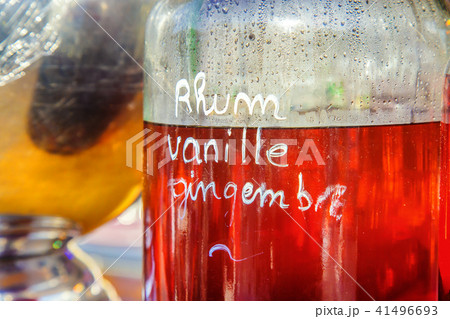 Bottle of rum with ginger drink in background Bottle of rum with ginger drink in background 41496693