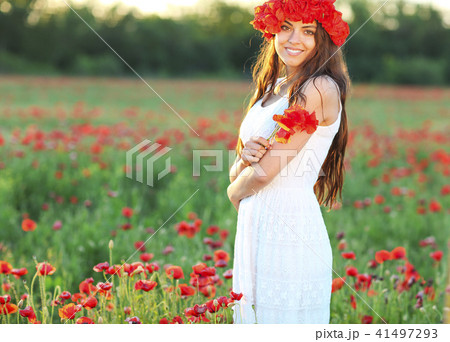 Portrait of young pretty girl with flower wreath Portrait of young pretty girl with flower wreath 41497293