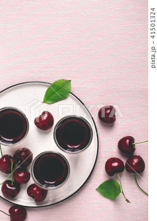 Cherry alcohol liquor or brandy on pink background Cherry alcohol liquor or brandy on pink background 41501324