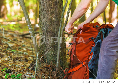 Hiker holding his camping backpack 41508432