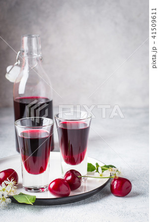 Cherry alcohol drink liquor on pink background 41509611