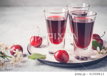 Cherry alcohol drink liquor on pink background 41509612