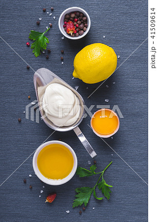 Mayonnaise sauce and ingredients on blue cloth Mayonnaise sauce and ingredients on blue cloth 41509614