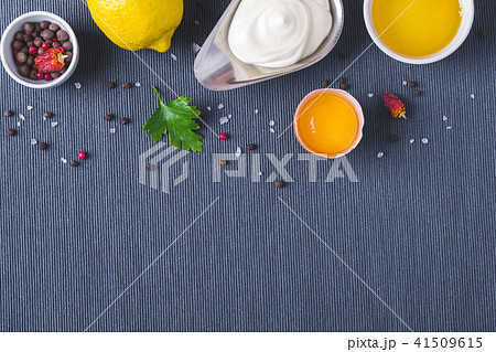 Mayonnaise sauce and ingredients on blue cloth Mayonnaise sauce and ingredients on blue cloth 41509615