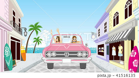 ピンクのオープンカーでドライブする二人の女性 レトロな街並みのイラスト素材