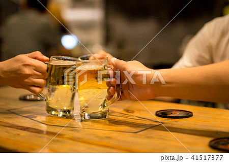Friend toasting with glasses beer in restaurant Friend toasting with glasses beer in restaurant 41517377