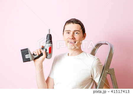 Image of man with drill near ladders Image of man with drill near ladders 41517413