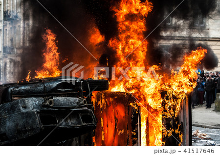 burning car. car destroyed and set on fire during the riots. city center burning car. car destroyed and set on fire during the riots. city center 41517646