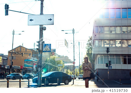 Young business woman walking along the street 41519730