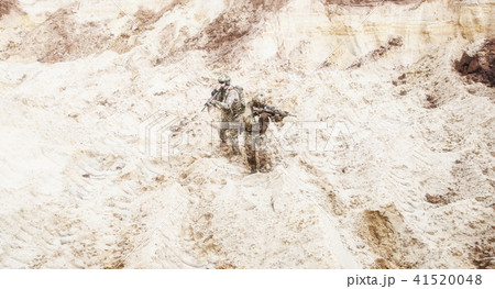 Infantrymen ready for fight moving in desert Infantrymen ready for fight moving in desert 41520048