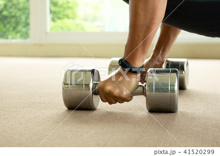 Sport man working out with dumbbells in gym 41520299