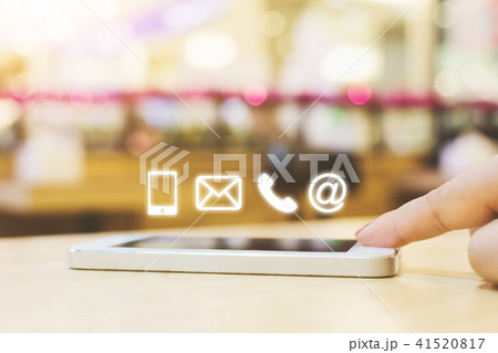 Woman hand pushing button smartphone 41520817