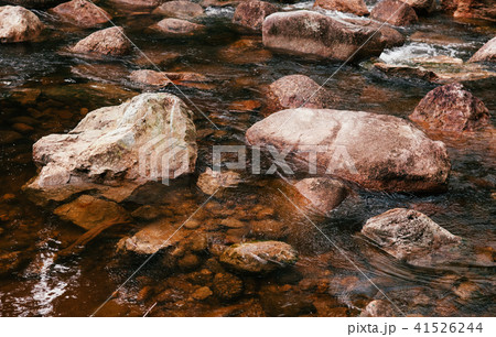 Tropical river flowing rapid water rocks landscape Tropical river flowing rapid water rocks landscape 41526244