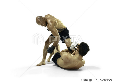 Two professional boxer boxing isolated on white studio background Two professional boxer boxing isolated on white studio background 41526459