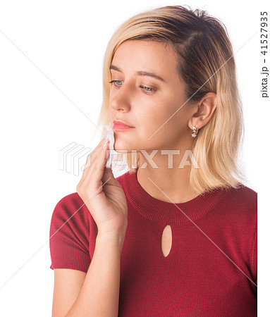 Woman Cleaning Face with white cotton pad.  41527935