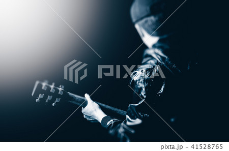 back of asian musician playing guitar on stage back of asian musician playing guitar on stage 41528765