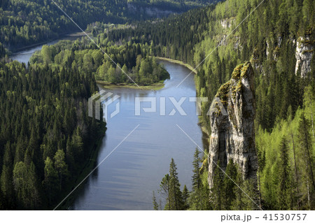 wooded river valley with rocks 41530757