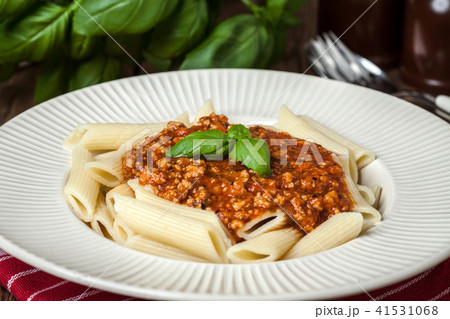 Penne a bolognese on white plate. Penne a bolognese on white plate. 41531068