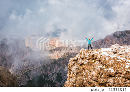 Woman on top rock Dolomites, Sella Ronda Woman on top rock Dolomites, Sella Ronda 41531315