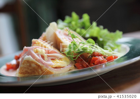 Breakfast burrito ham and eggs with salad vintage style 41535020